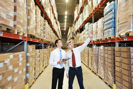 39054518 - two managers workers in warehouse with bar code scanner